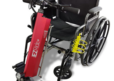 An image of the EZRide unit connected to a manual wheelchair - front