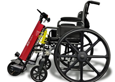 An image of the EZRide unit connected to a manual wheelchair - side